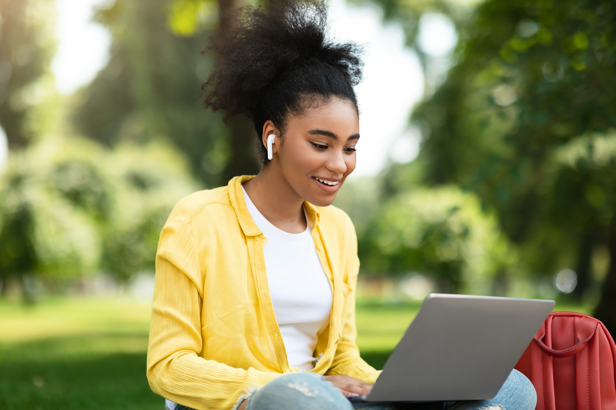 Black Student Girl Talking To Laptop Webcam During Webinar Outdoor