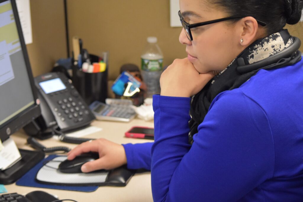 Customer service representative with computer and headset