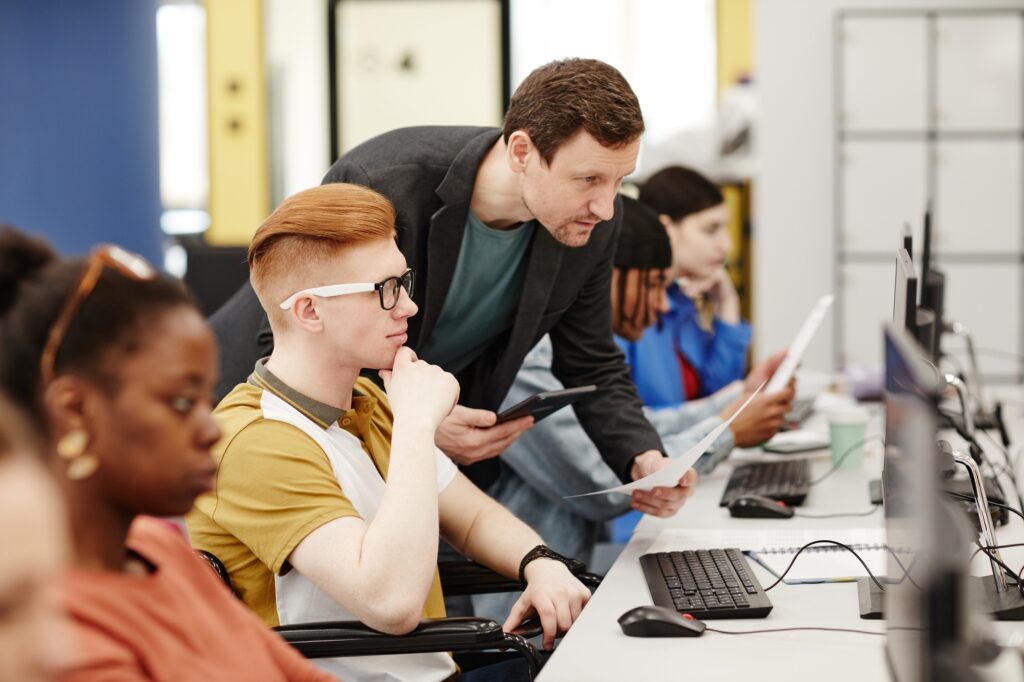 Professor Helping Students in Class